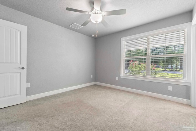 591 Nowak Rd, Cantonment, FL 32533 - unfurnished room with carpet, a textured ceiling, ceiling fan, and baseboards
