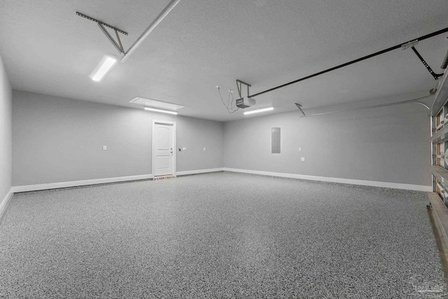 591 Nowak Rd, Cantonment, FL 32533 - garage with electric panel, baseboards, and a garage door opener