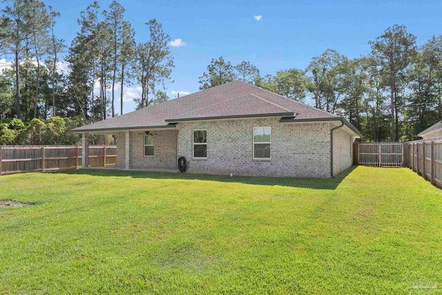 591 Nowak Rd, Cantonment, FL 32533 - rear view of house with a ceiling fan, brick siding, and a shingled roof