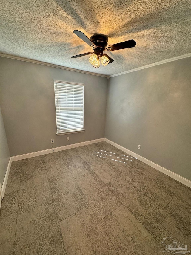 spare room with baseboards, ceiling fan, a textured ceiling, and crown molding