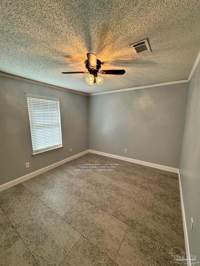 empty room featuring visible vents, ornamental molding, ceiling fan, a textured ceiling, and baseboards