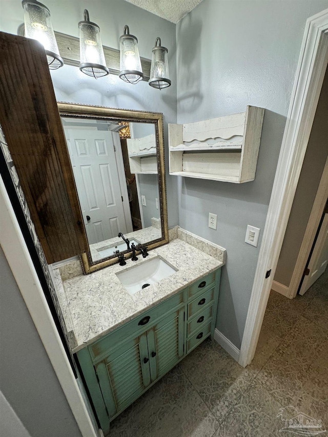 bathroom featuring vanity and baseboards