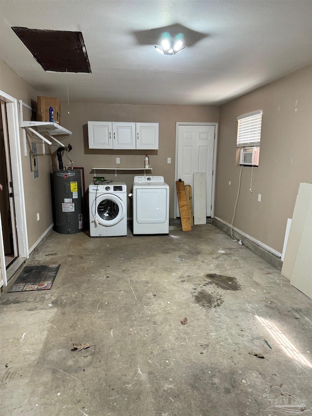 interior space with washing machine and dryer, baseboards, cooling unit, and electric water heater