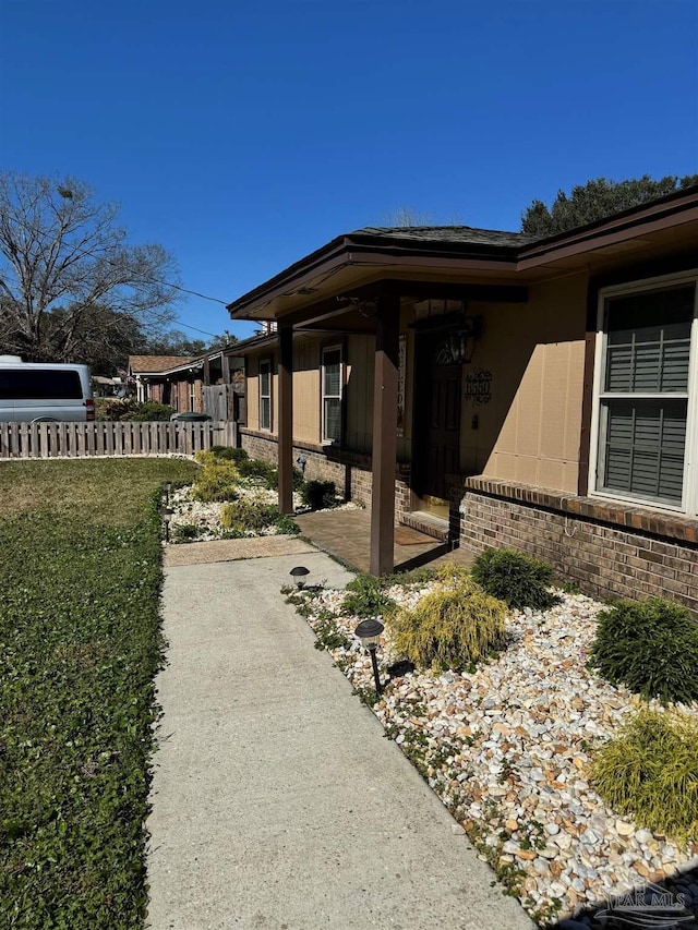 view of patio featuring fence