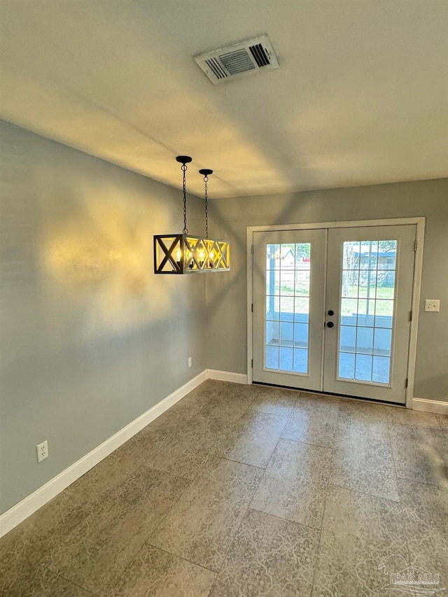 entryway featuring baseboards, visible vents, and french doors