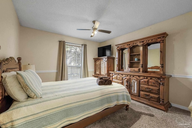 bedroom with carpet floors, a textured ceiling, and ceiling fan