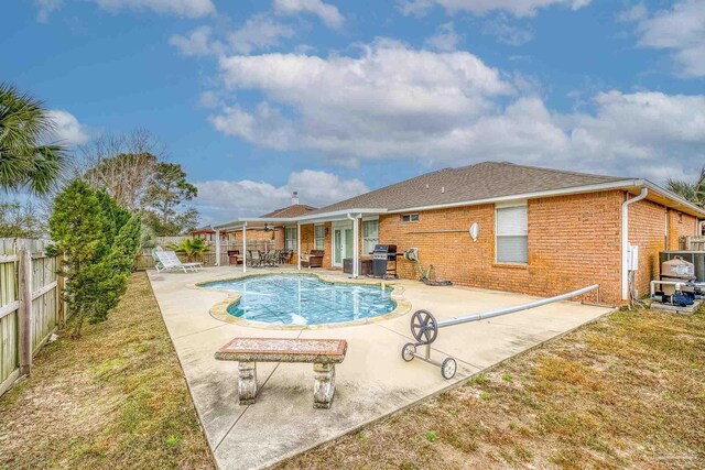 view of pool featuring a patio area and a grill