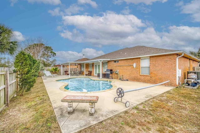 view of swimming pool with a patio area and area for grilling