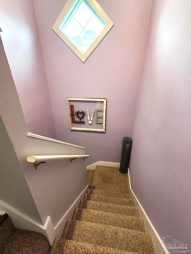 stairway with baseboards