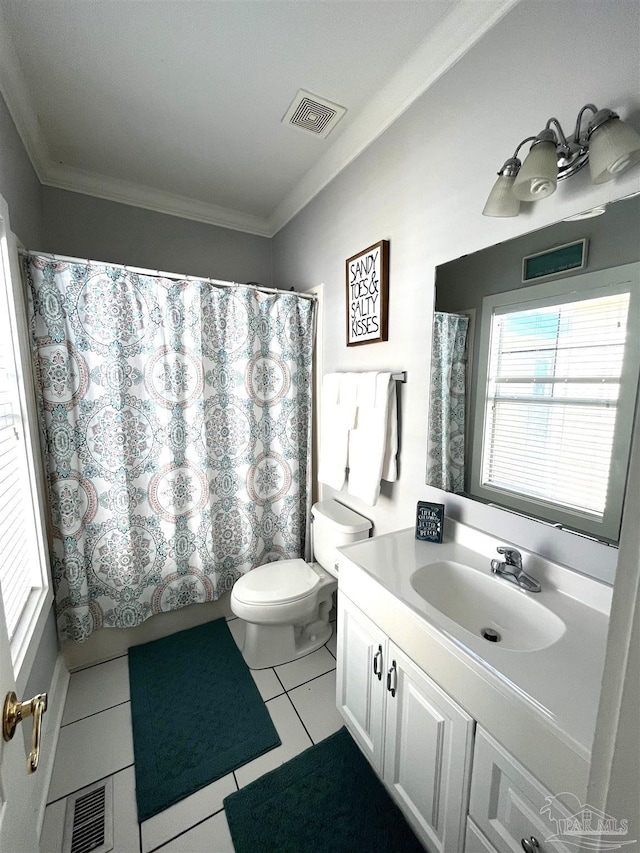 bathroom with tile patterned flooring, vanity, ornamental molding, toilet, and walk in shower