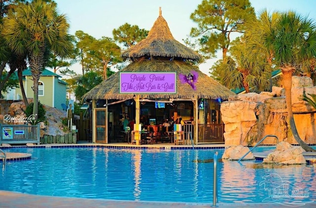 view of swimming pool with fence