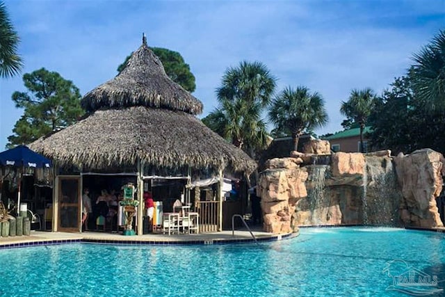 view of swimming pool featuring a gazebo and pool water feature