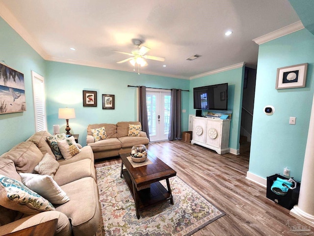 living room featuring crown molding, hardwood / wood-style flooring, french doors, and ceiling fan