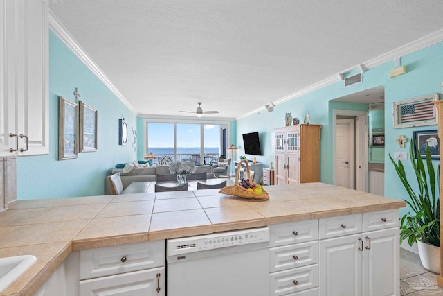 4050 Indigo Dr Unit 102, Pensacola, FL 32507 - kitchen with dishwasher, crown molding, a ceiling fan, open floor plan, and a textured ceiling