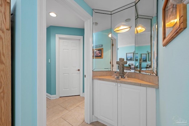 4050 Indigo Dr Unit 102, Pensacola, FL 32507 - bathroom with tile patterned floors, vanity, and baseboards