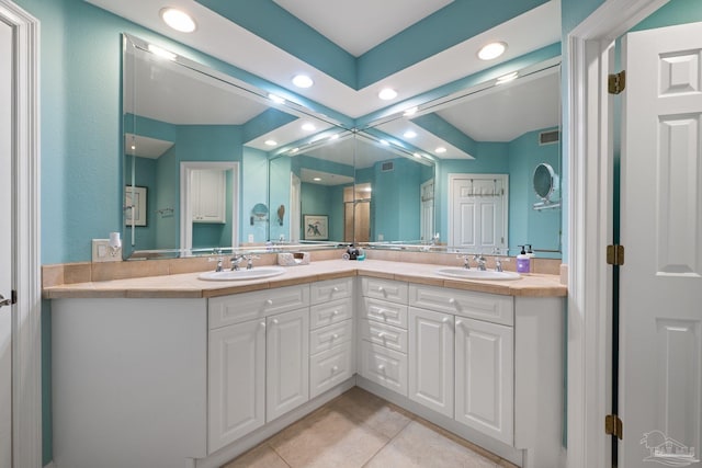 4050 Indigo Dr Unit 102, Pensacola, FL 32507 - bathroom featuring recessed lighting, tile patterned floors, double vanity, and a shower with door