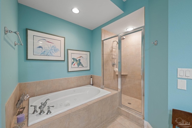 4050 Indigo Dr Unit 102, Pensacola, FL 32507 - full bathroom with a stall shower, a tub with jets, and tile patterned floors