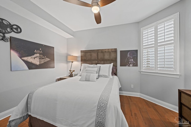 4050 Indigo Dr Unit 102, Pensacola, FL 32507 - bedroom featuring wood finished floors, baseboards, a ceiling fan, and multiple windows