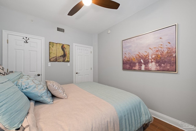 4050 Indigo Dr Unit 102, Pensacola, FL 32507 - bedroom featuring wood finished floors, baseboards, and ceiling fan