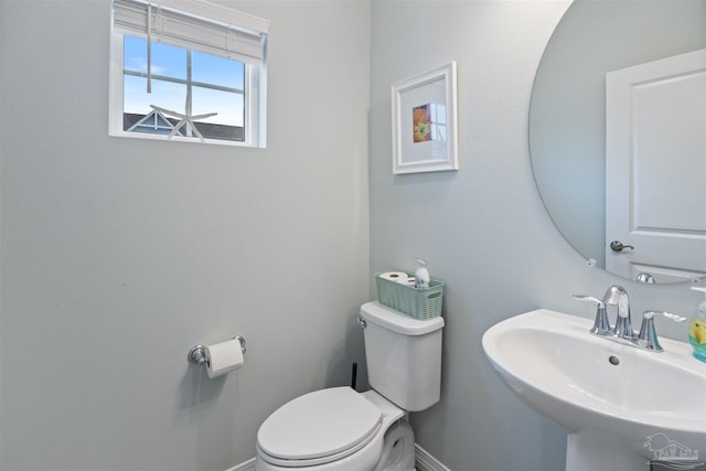 bathroom featuring sink and toilet