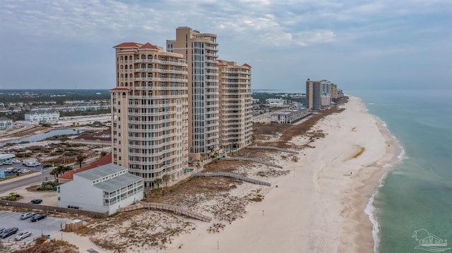 bird's eye view with a water view and a view of the beach