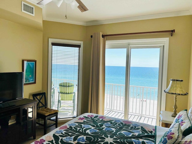 bedroom with crown molding, a water view, visible vents, and access to exterior