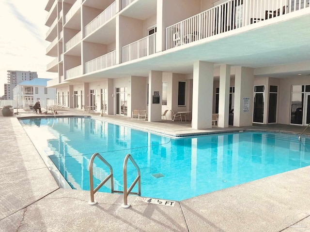 pool featuring a patio area