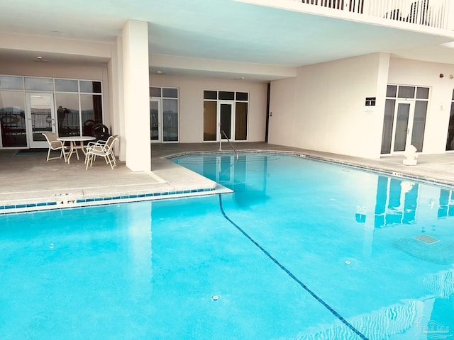 community pool featuring a patio area