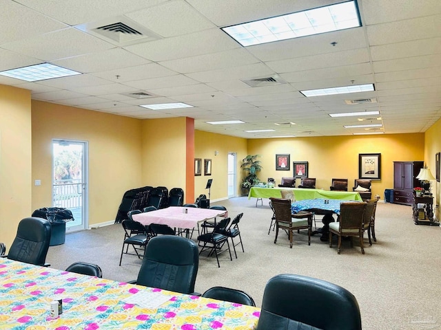 dining area with carpet, visible vents, and baseboards