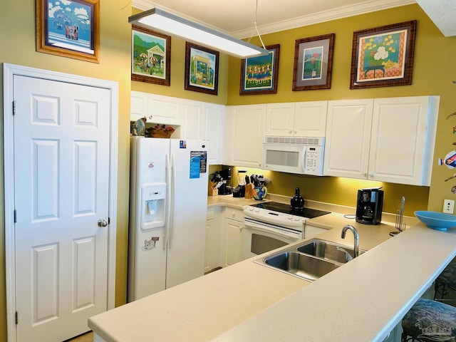 kitchen with white appliances, white cabinets, light countertops, crown molding, and a sink