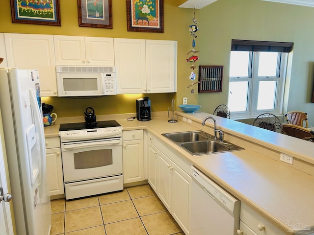 kitchen featuring light tile patterned floors, white appliances, a sink, white cabinetry, and light countertops