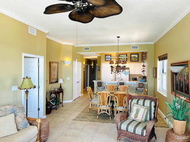 living area featuring ornamental molding, visible vents, baseboards, and light tile patterned flooring