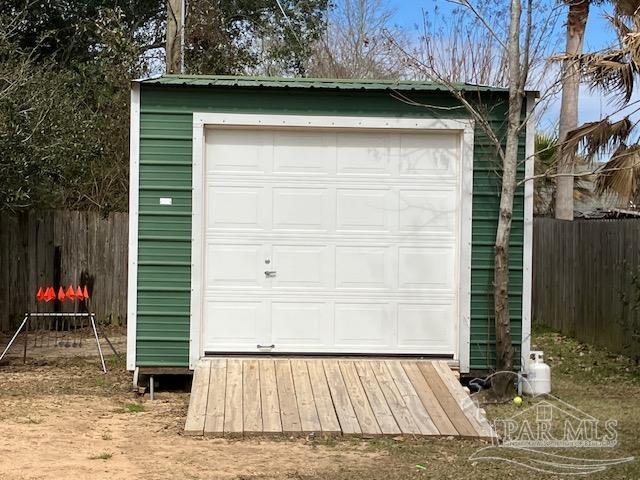 garage featuring fence