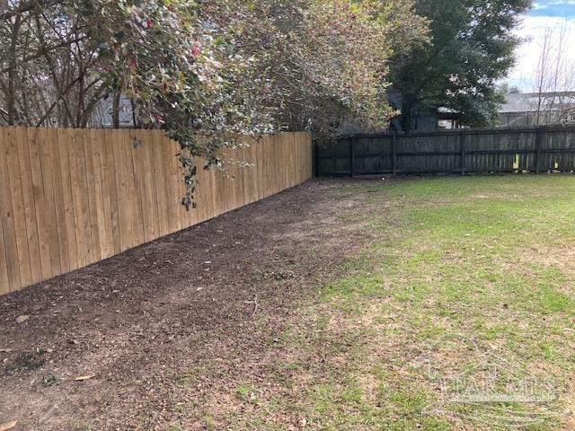 view of yard with fence