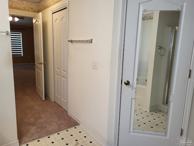 hallway with light colored carpet