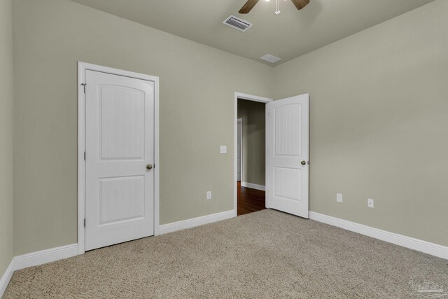 unfurnished bedroom with carpet and ceiling fan