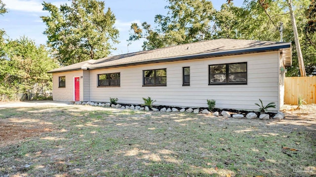 ranch-style house with a front lawn