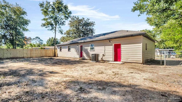 rear view of property with central air condition unit