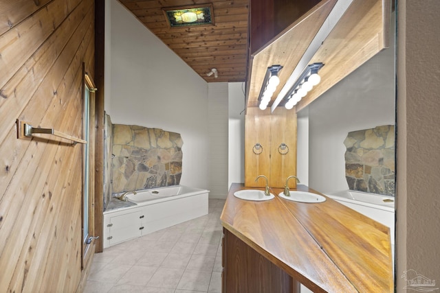 1221 Tecumseh Pl, Pensacola, FL 32514 - full bath with a garden tub, wooden ceiling, double vanity, and tile patterned flooring