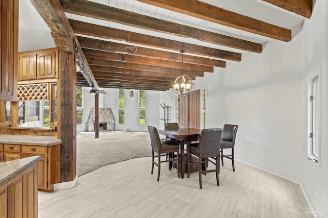 1221 Tecumseh Pl, Pensacola, FL 32514 - dining space with beamed ceiling, light wood-type flooring, a chandelier, wooden walls, and a wood stove