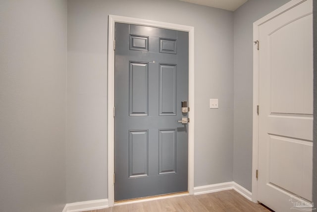 entryway with light hardwood / wood-style floors