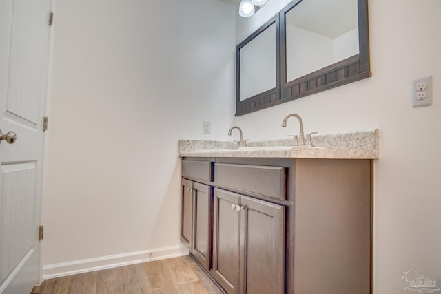 bathroom featuring vanity and hardwood / wood-style flooring