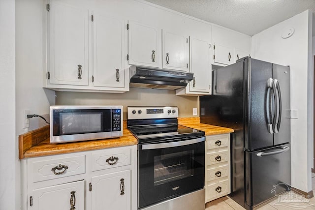 kitchen with white cabinets, a textured ceiling, appliances with stainless steel finishes, and under cabinet range hood