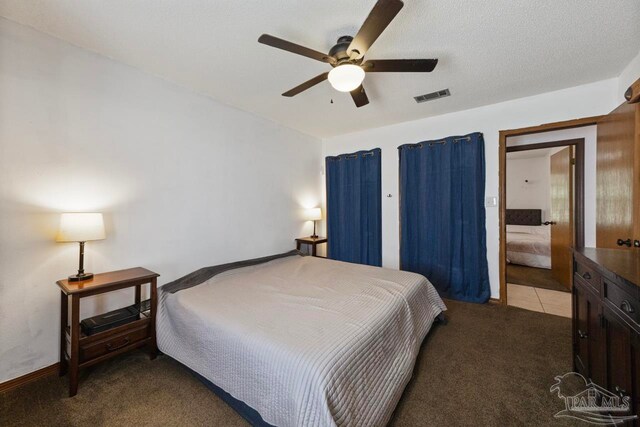 bedroom with light colored carpet, ceiling fan, and visible vents