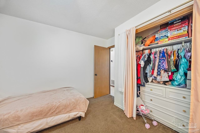 carpeted bedroom featuring visible vents