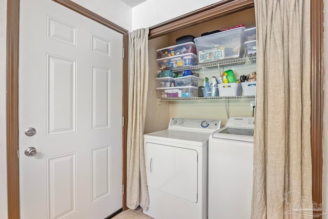 laundry room featuring washing machine and dryer and laundry area