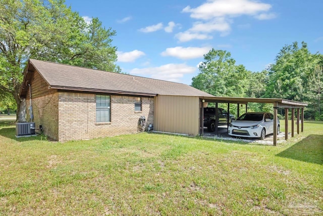 view of property exterior featuring brick siding, a yard, and central AC unit