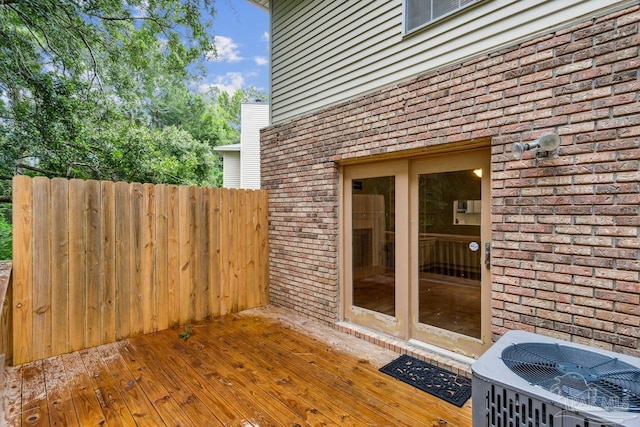 wooden terrace featuring central AC unit