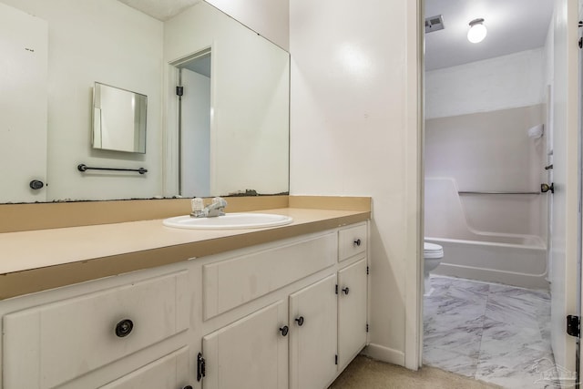 full bathroom featuring washtub / shower combination, tile patterned flooring, toilet, and vanity