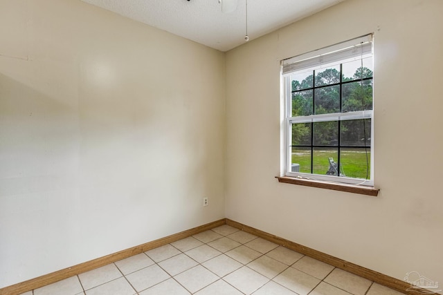 tiled empty room with plenty of natural light